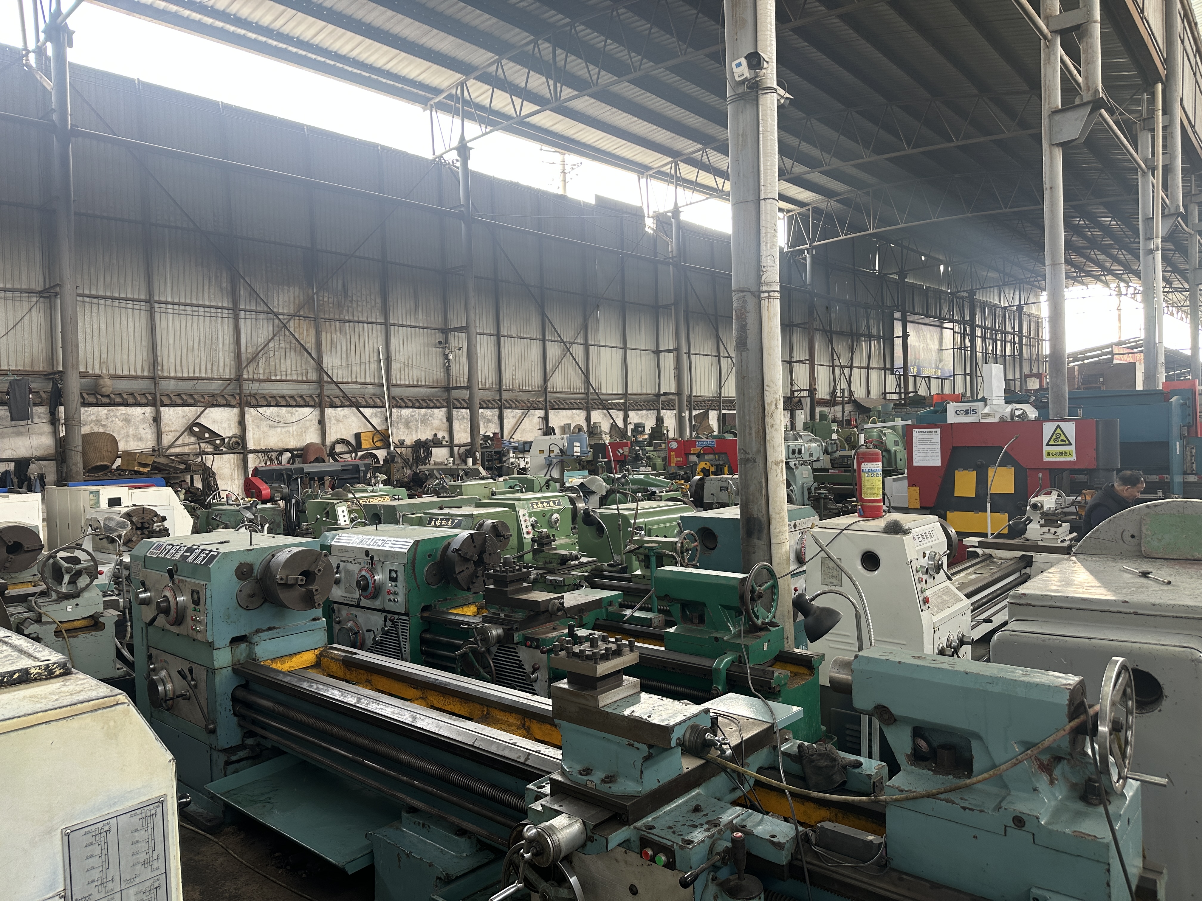 Machining equipment warehouse with lathes and industrial machines